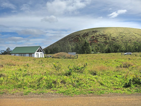 A house and a hill on Rapa Nui, Chile.