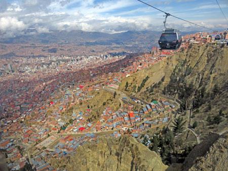 A cabin on the Mi Teleferico aerial cable car system transits over La Paz, Bolivia.
