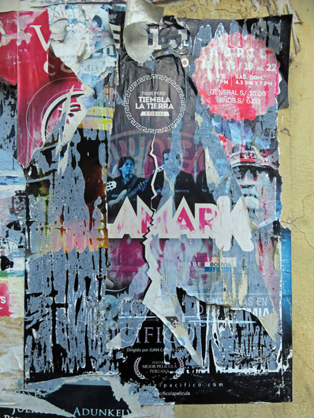 Layered and torn flyers in Puno, Peru.