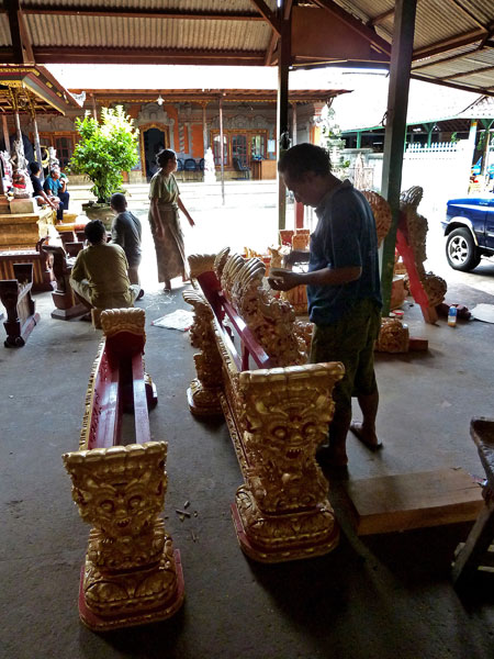 Painting actual gold, not paint, onto the instruments at the gamelan foundry in Blahbatuh, Bali.
