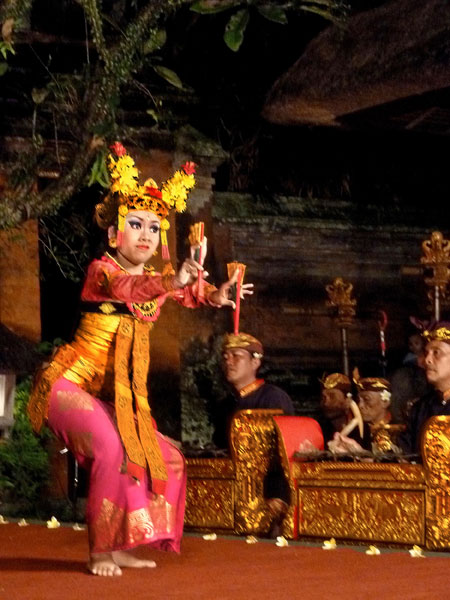 A member of the Sekehe Gong Panca Artha troupe performs the Legong dance at Ubud Palace in Ubud, Bali.