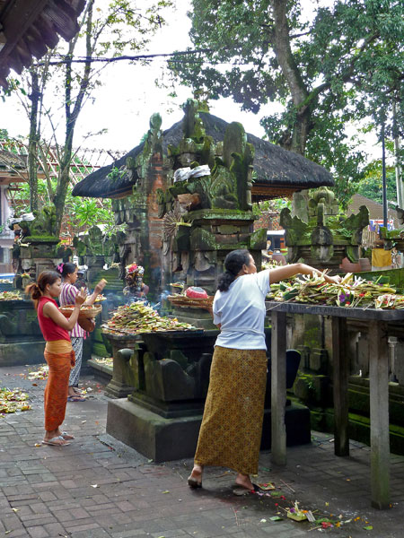 Offerings and prayer in Ubud, Bali.