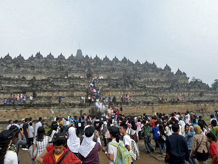 The tour bus throngs arrive at Borobudur near Magelang, Central Java.