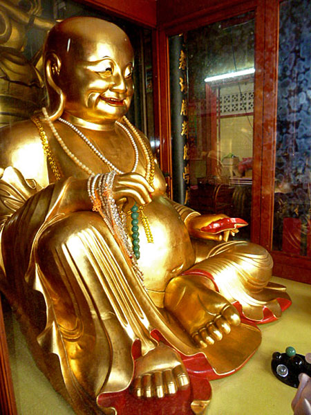 A golden Buddha at the Sakaya Muni Buddha Gaya Temple in Little India, Singapore.
