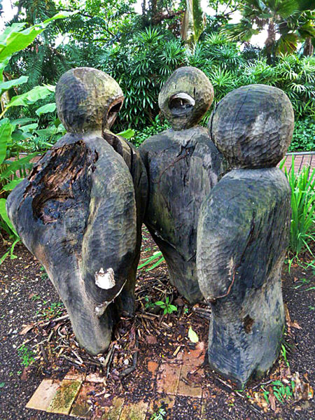 A trio of wood sculptures in Fort Canning, Singapore.