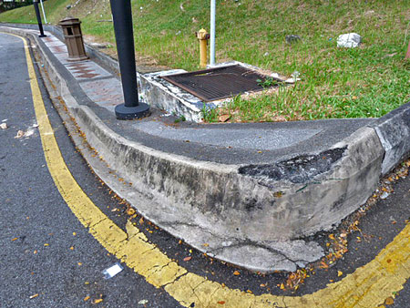 This sidewalk is so steep, you could easily drop in on it. Kuala Lumpur, Malaysia.