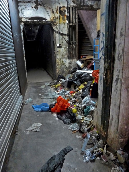 A big pile of random hallway trash right by my favorite alley food stall in Chinatown, Kuala Lumpur, Malaysia.