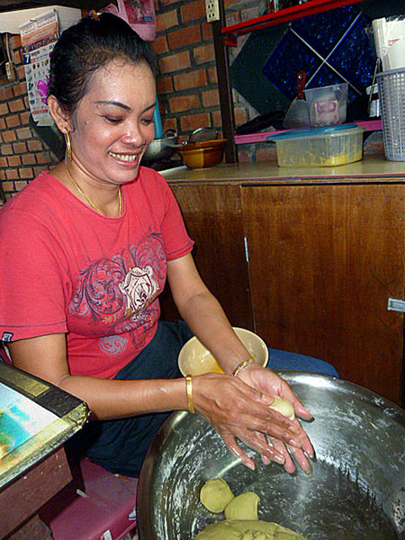 As Thai as they come, Aoi prepares pancake batter in her food stall on Ko Phi Phi Don, Thailand.