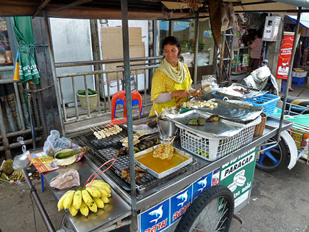 This lady sold me yummy fried bananas on a stick in Phuket Town, Thailand.