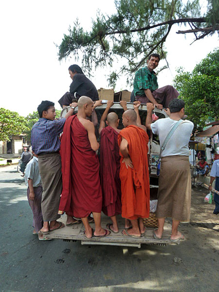 Buddhist monks on the go, take two, in Mandalay, Myanmar.