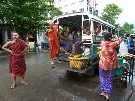 Buddhist monks on the go in Mandalay, Myanmar.