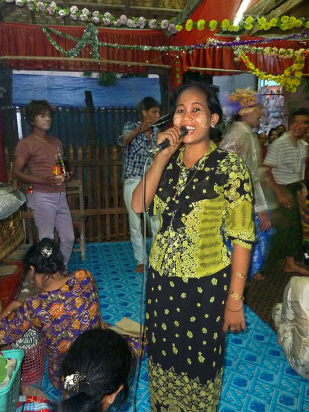 A singer gives me a big smile during the nat pwe in Taungbyone, Myanmar.