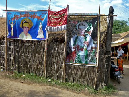Posters announcing upcoming services of nat kadaws at the nat pwe in Taungbyone, Myanmar.