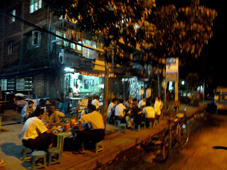 Yangon, Myanmar: A fine place for grown men to sit on tiny plastic chairs and tables designed for midgets.