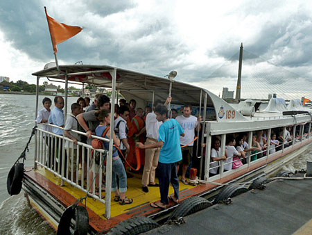 An overloaded river taxi gets ready to sink in Bangkok, Thailand.