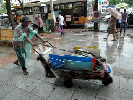 Even more elusive than the broom cart is the spectacular low-slung rubbish cart in Banglamphu, Bangkok, Thailand.