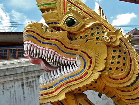 Close-up of a guard dragon in front of one of the insanely nice-looking temples at Wat Kuan Kama in Chiang Mai, Thailand.