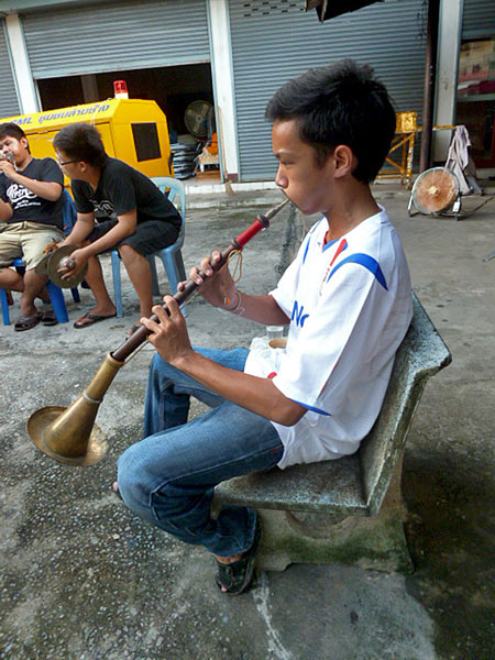 One of the raspy horn players of Wat Lam Chang Vieng Phing in Chiang Mai, Thailand.