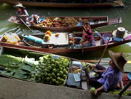 A cornucopia of colorful food at the floating market in Damnoen Saduak, Thailand.