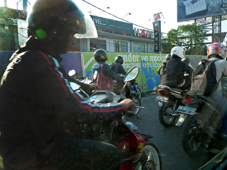 Standard motorcycle chaos in Denpasar, Bali, Indonesia.
