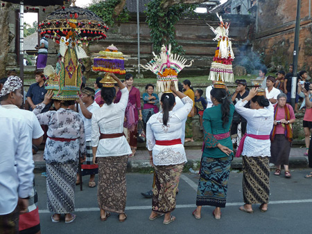 Women prepare for a short procession at Pura Marajan Agung in Ubud, Bali, Indonesia.