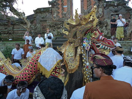 The dragon rests after descending the steep stairs during a short procession at Pura Marajan Agung in Ubud, Bali, Indonesia.