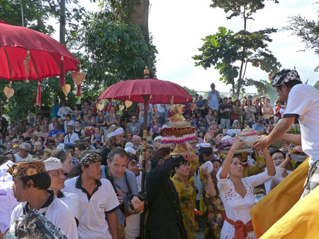 People offer last gifts to Tjokorda Putra Di Armayudha during the royal cremation ceremony at Pura Dalem Puri in Ubud, Bali, Indonesia.