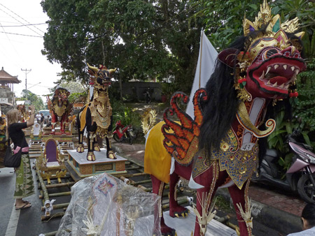 A fierce dragon / lion / horse hybrid with wings rules the staging area of the royal cremation ceremony in Ubud, Bali, Indonesia.