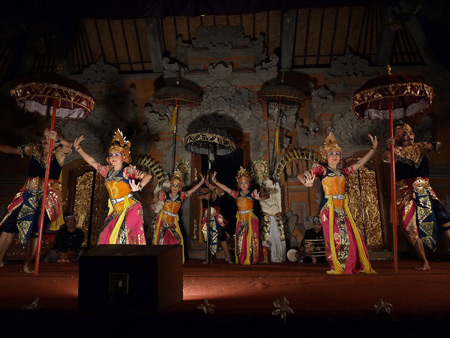 Sekaa Gong Jaya Swara performs the Tedung Agung dance at Ubud Palace in Ubud, Bali, Indonesia.