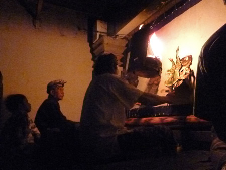 The Dalang (puppet master) performs Wayang Kulit at Oka Kartini in Ubud, Bali, Indonesia.