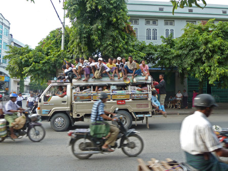 The cast of Hee-Haw barnstorms through the streets of Mandalay, Myanmar.
