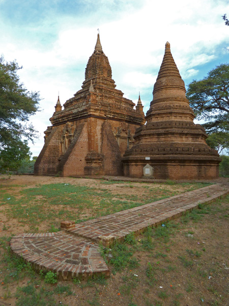More magnificent Buddhist temples along the road at sunset in Bagan, Myanmar.