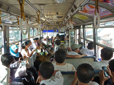 Yellow bus number 1 heads toward Shwedagon Pagoda in Yangon, Myanmar.