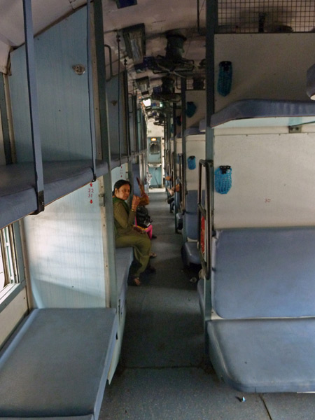 A typical Indian Railways non-air con sleeper car en route from Agra to Delhi, India.