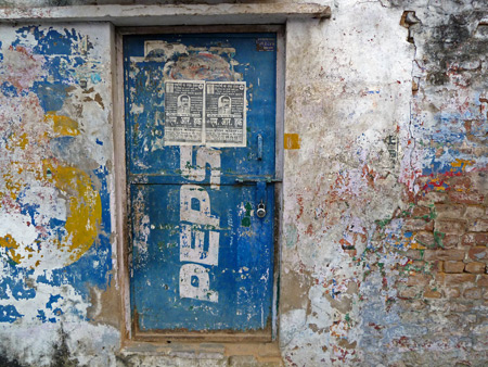 A faded wall in a back lane in the Taj Ganj area of Agra, India.