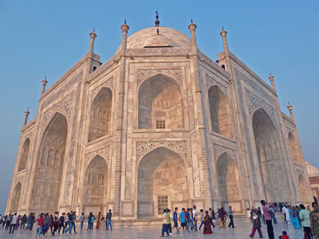 The Taj Mahal mausoleum bathed in the setting sunlight in Agra, India.