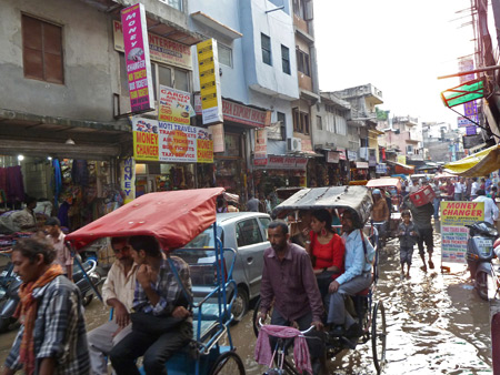 A flooded street in the Main Bazaar of Paharganj, Delhi, India.