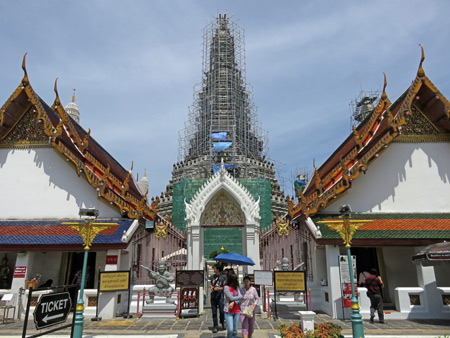 Wat Arun covered with scaffolding in Thonburi, Bangok, Thailand.