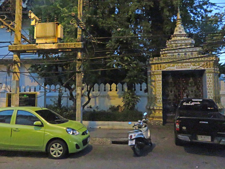 The power grid and a temple gate in Chiang Mai, Thailand.