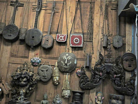 Stringed instruments and masks in a shop in Chiang Mai, Thailand.