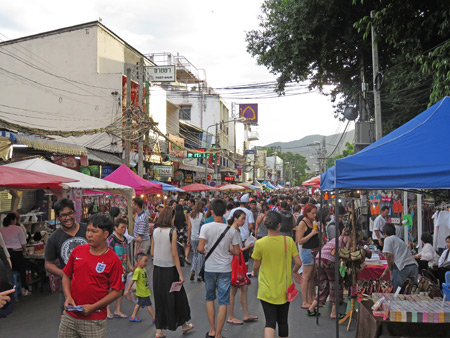 A bustling street market at Tapae Gate in Chiang Mai, Thailand.