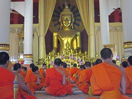 An afternoon Buddhist prayer service at Wat Phra Singh in Chiang Mai, Thailand.