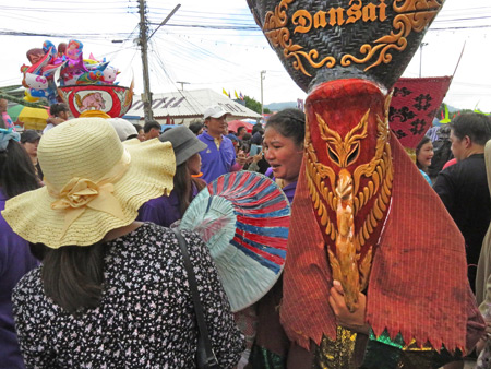 A lady and a ghost in the parade at the Phi Ta Khon festival in Dan Sai, Thailand.