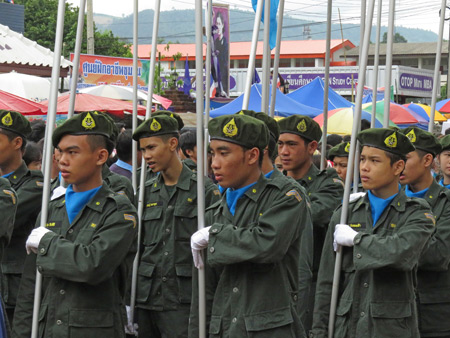 Some military boys join the parade at the Phi Ta Khon festival in Dan Sai, Thailand.