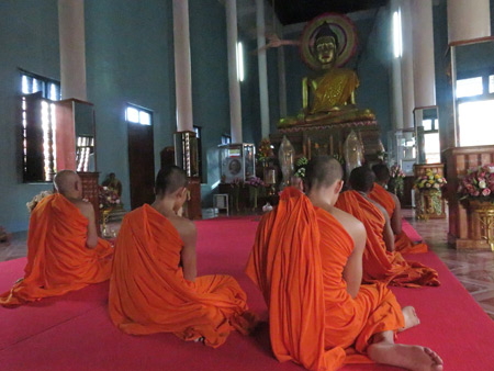 An evening Buddhist prayer service at Wat Preah Prom Rath in Siem Reap, Cambodia. 