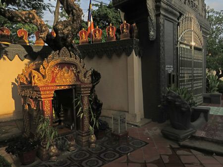 A small Buddhist shrine in the setting sun at Wat Preah Prom Rath in Siem Reap, Cambodia.