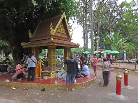 A Buddhist prayer service at a small shrine outside Wat Preah Ang Chek + Wat Preah Ang Chom in Siem Reap, Cambodia.