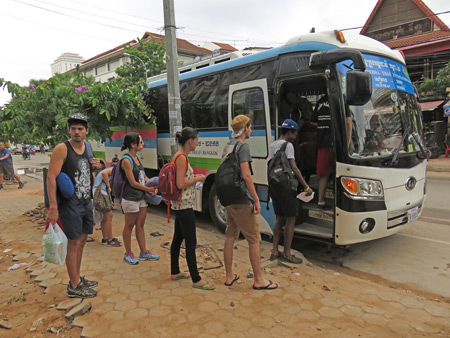 Boarding the Attakan bus from Siem Reap, Cambodia to Bangkok, Thailand.