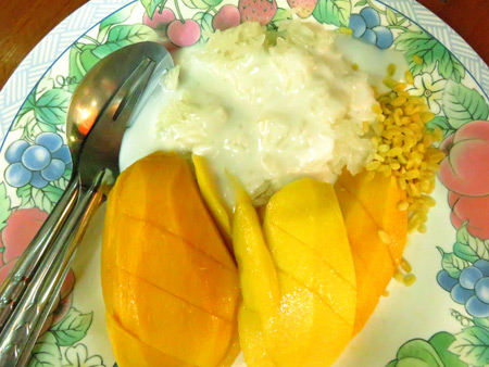 Mango and sticky rice on Sukhumvit Soi 38 in Bangkok, Thailand.