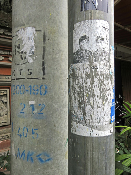 A torn flyer on Jalon Suweta in Ubud, Bali, Indonesia.